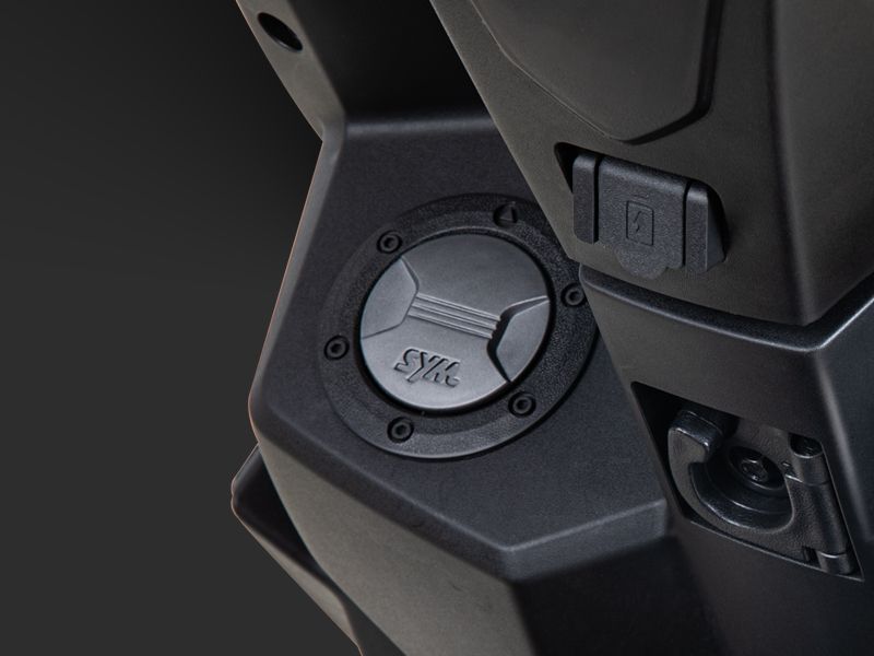 Front-mounted fuel cap